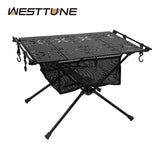 A portable aluminum alloy camping folding table with a black surface and green edges, featuring mesh pockets and foldable legs.