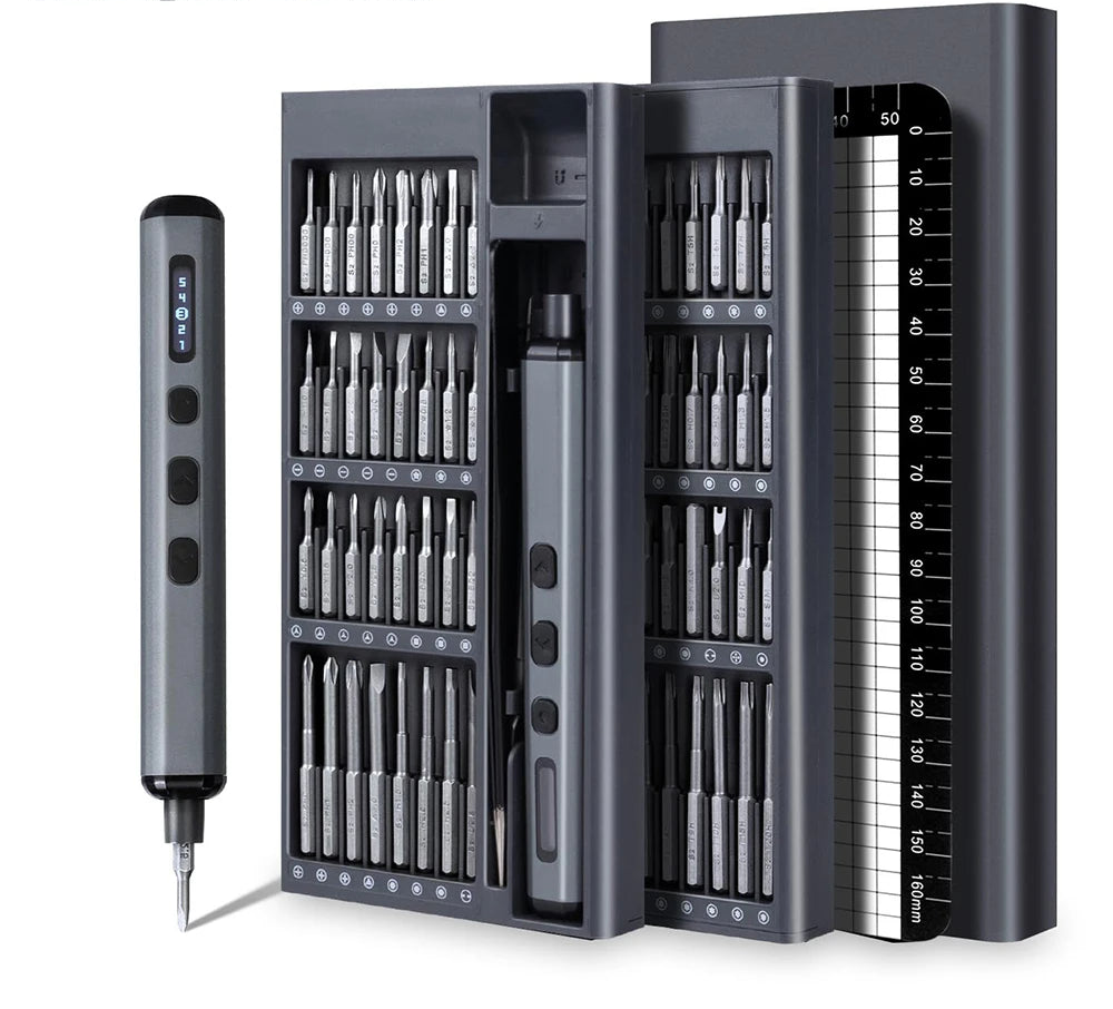 Multi-tool set with various bits and a ruler on a white background